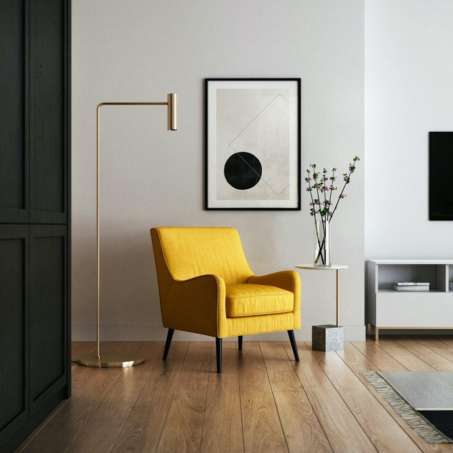 Interior detail with a mustard armchair and framed art