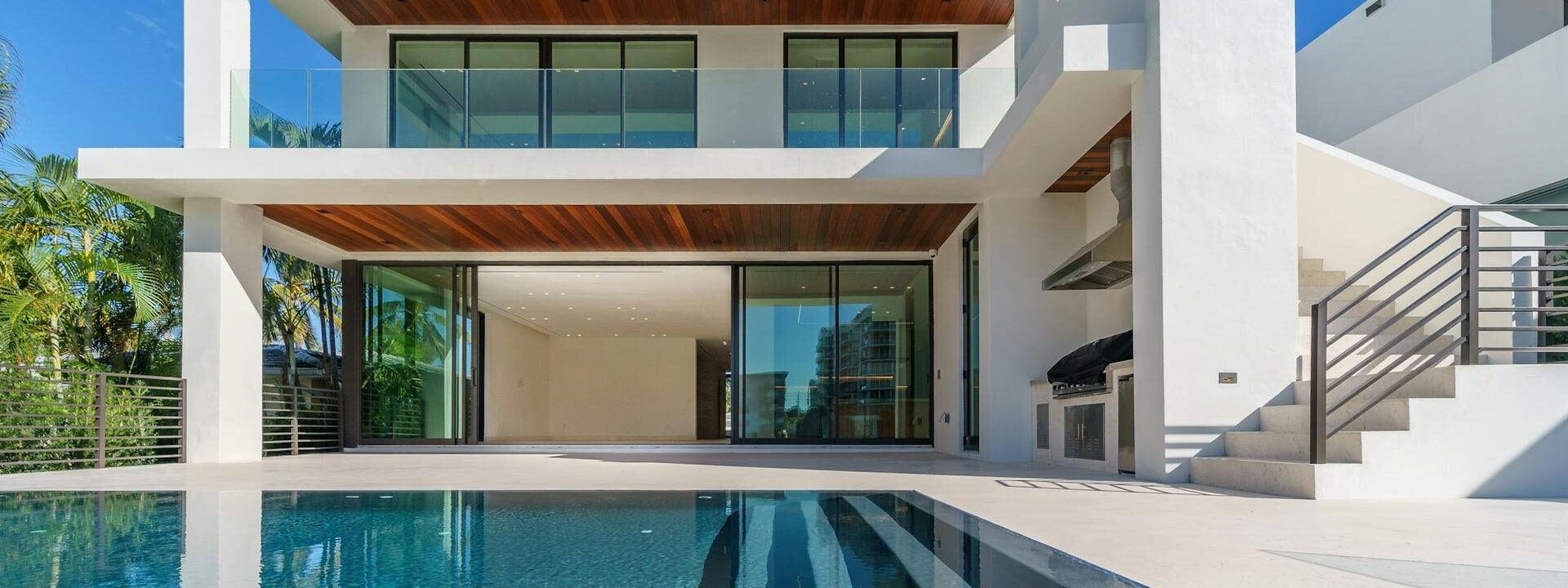 Contemporary white villa with a swimming pool designed by architects in Hyderabad