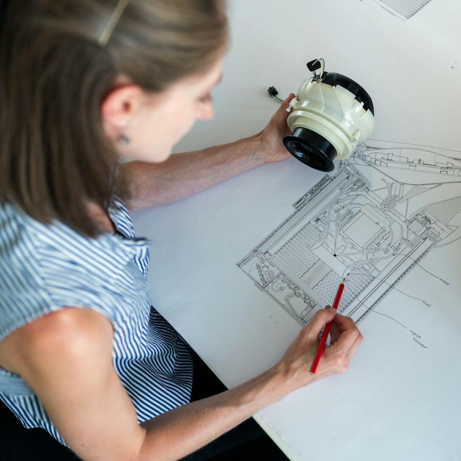 Designer sketching a building plan by hand