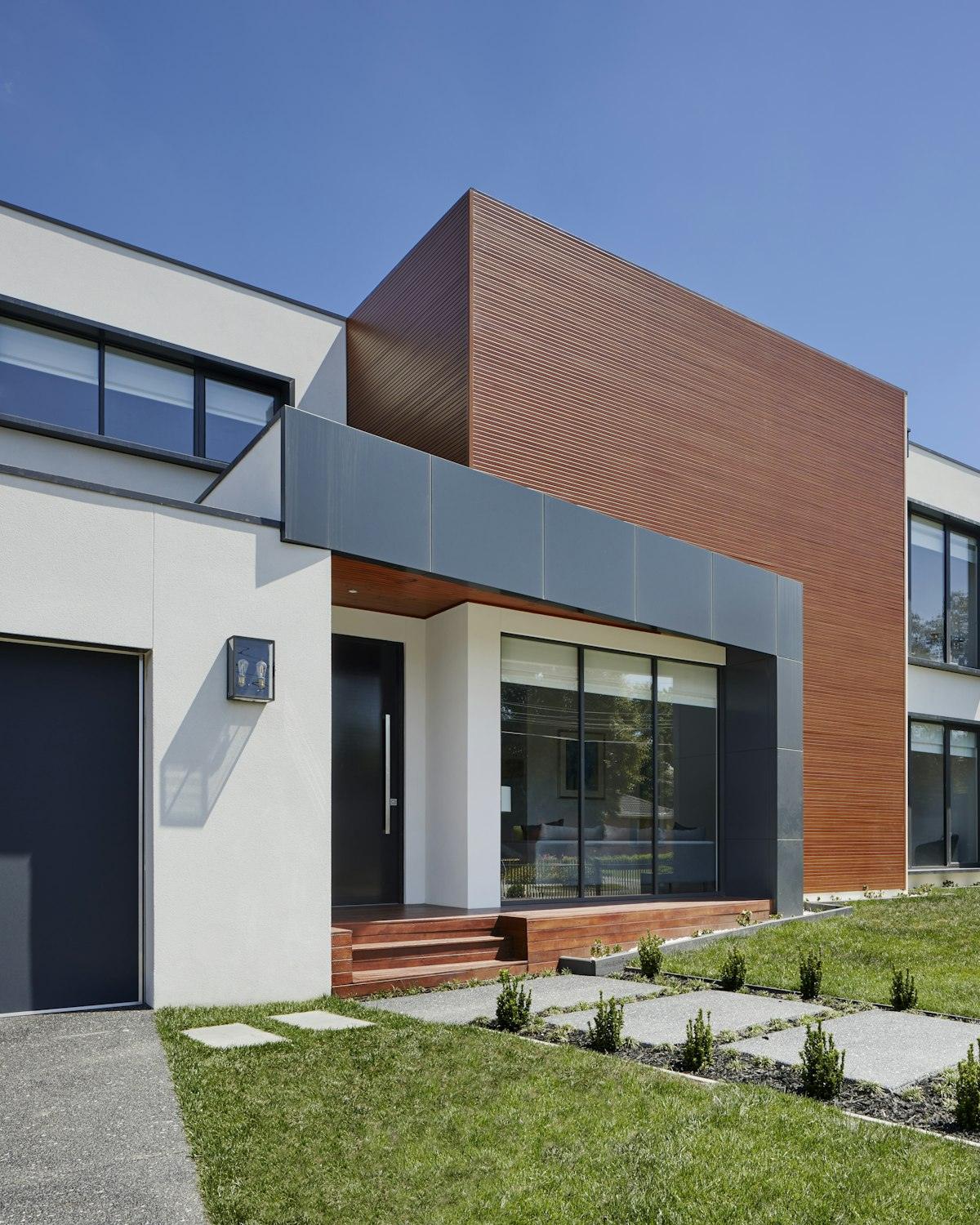 Contemporary house with timber-toned cladding and white walls
