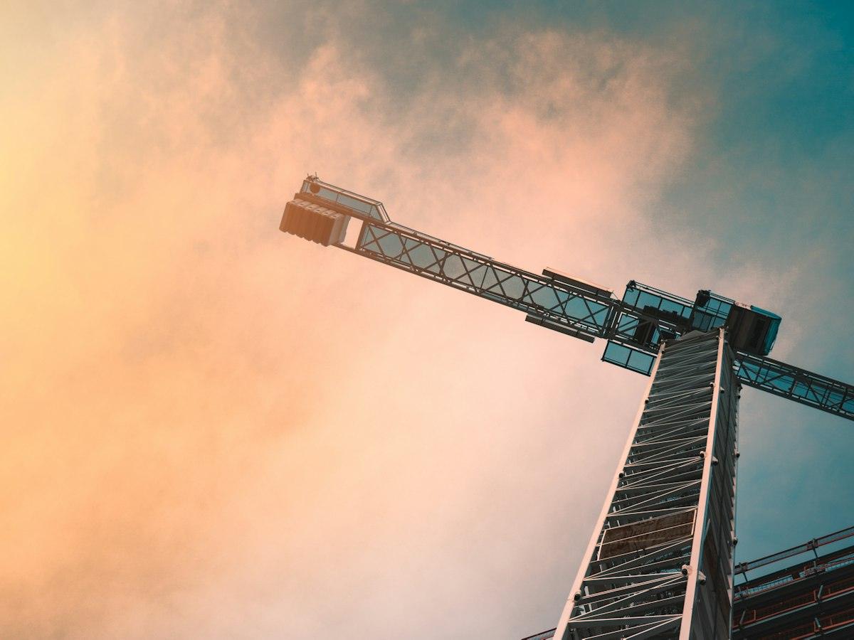 Tower crane against an evening sky
