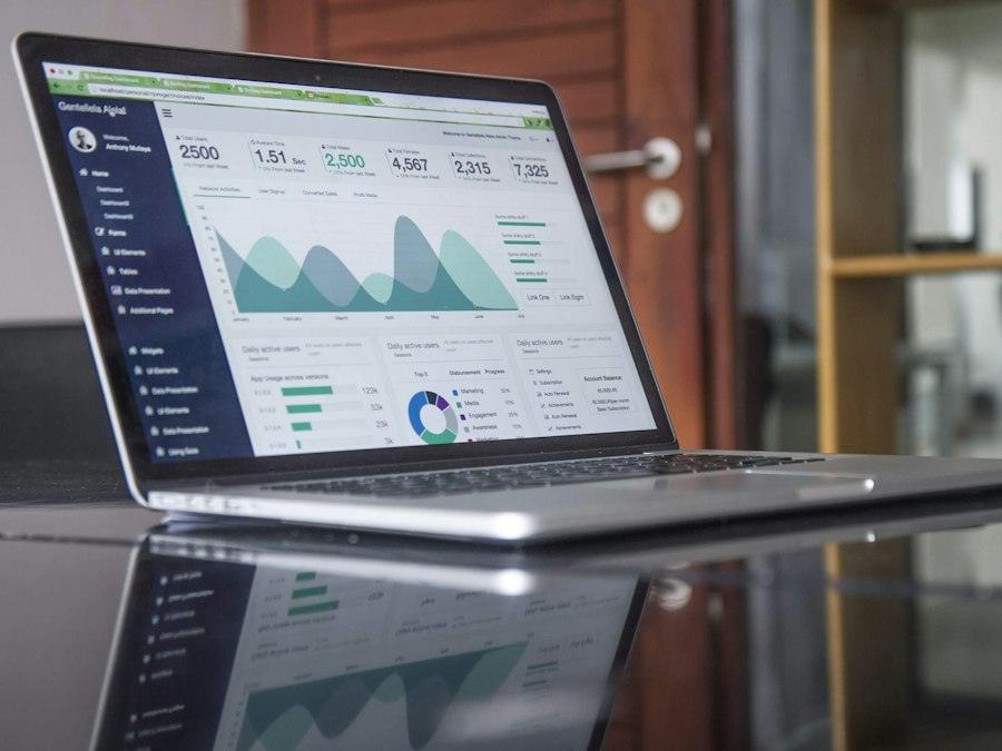 Laptop showing cost and progress charts